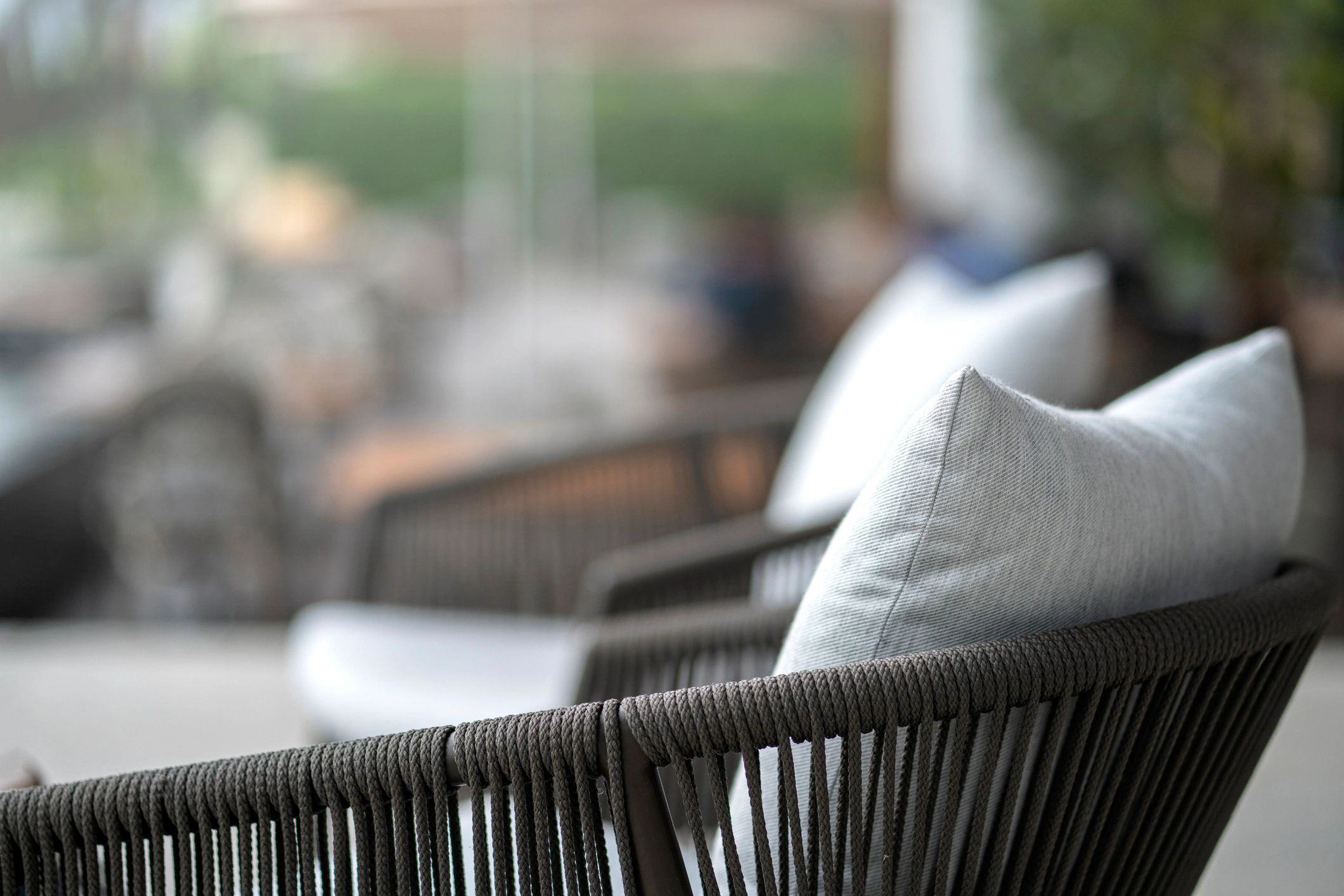 Decorative outdoor cushions arranged on a chair